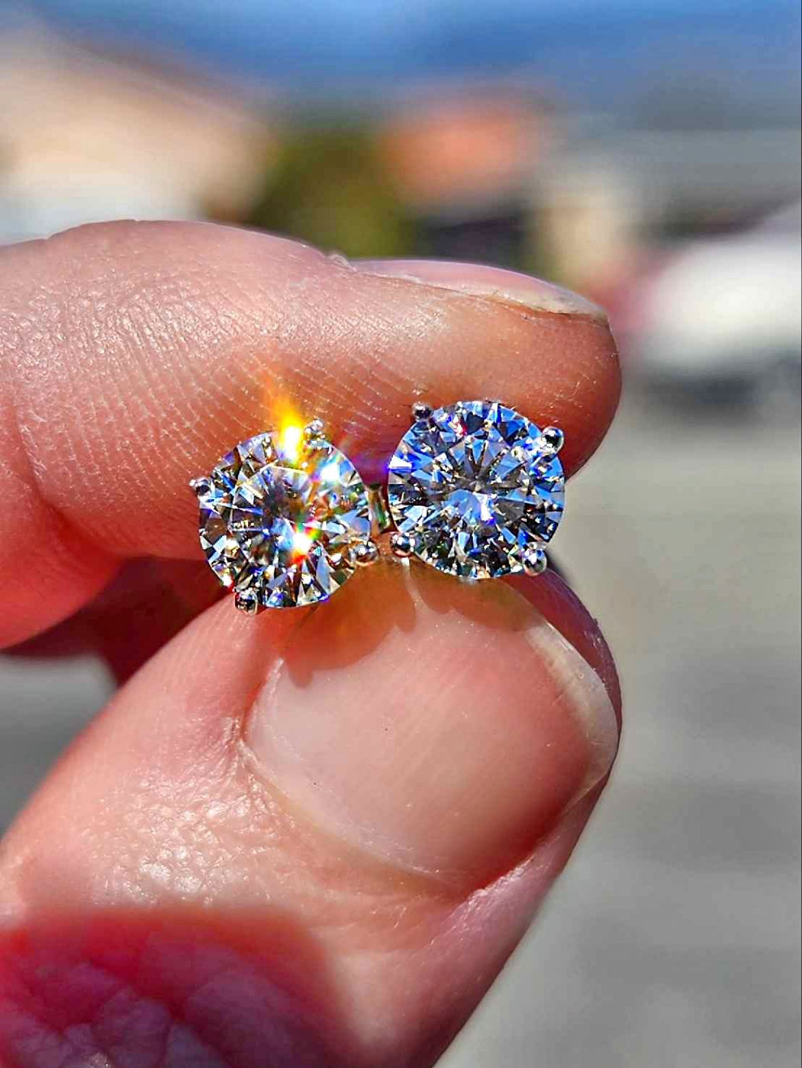 2 Carat Moissanite Round 18kt White Gold Plated Sterling Silver Stud Earrings.