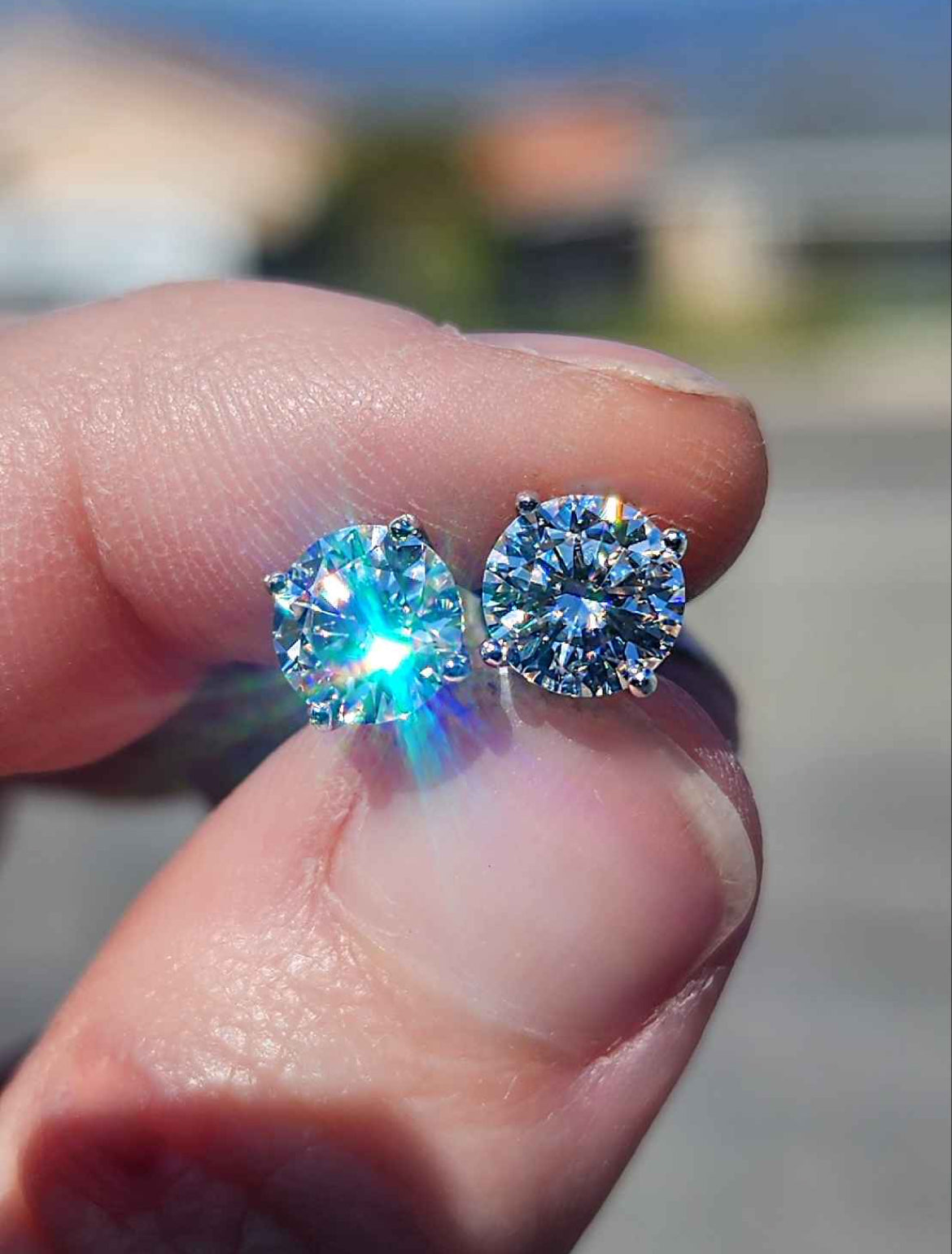 2 Carat Moissanite Round 18kt White Gold Plated Sterling Silver Stud Earrings.