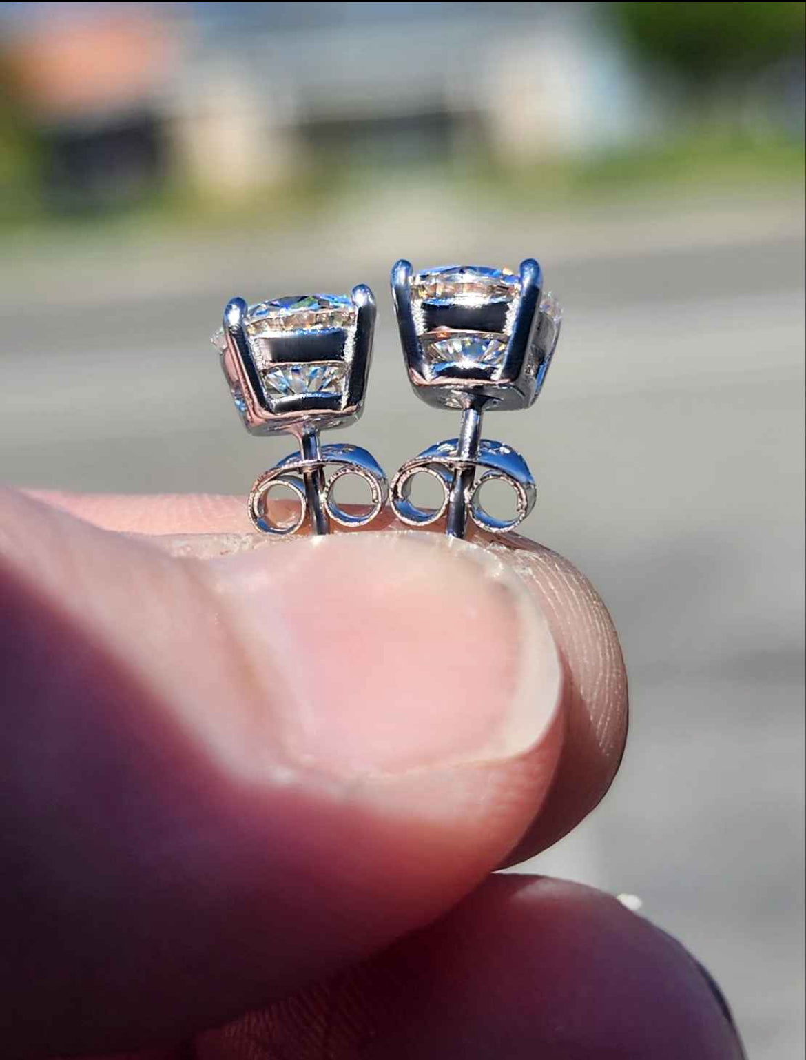 2 Carat Moissanite Round 18kt White Gold Plated Sterling Silver Stud Earrings.